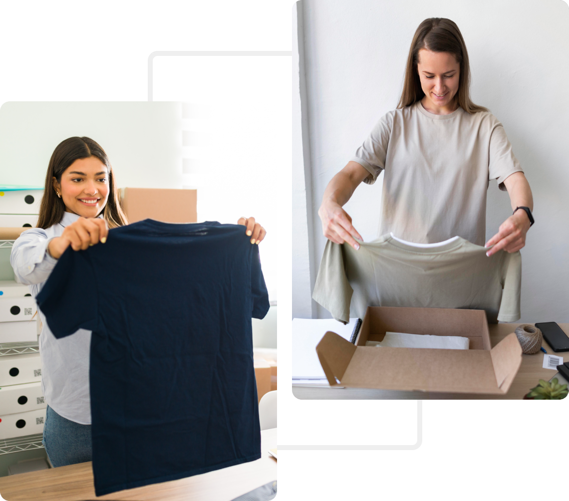 Two women unboxing and holding up new clothing items with smiles.