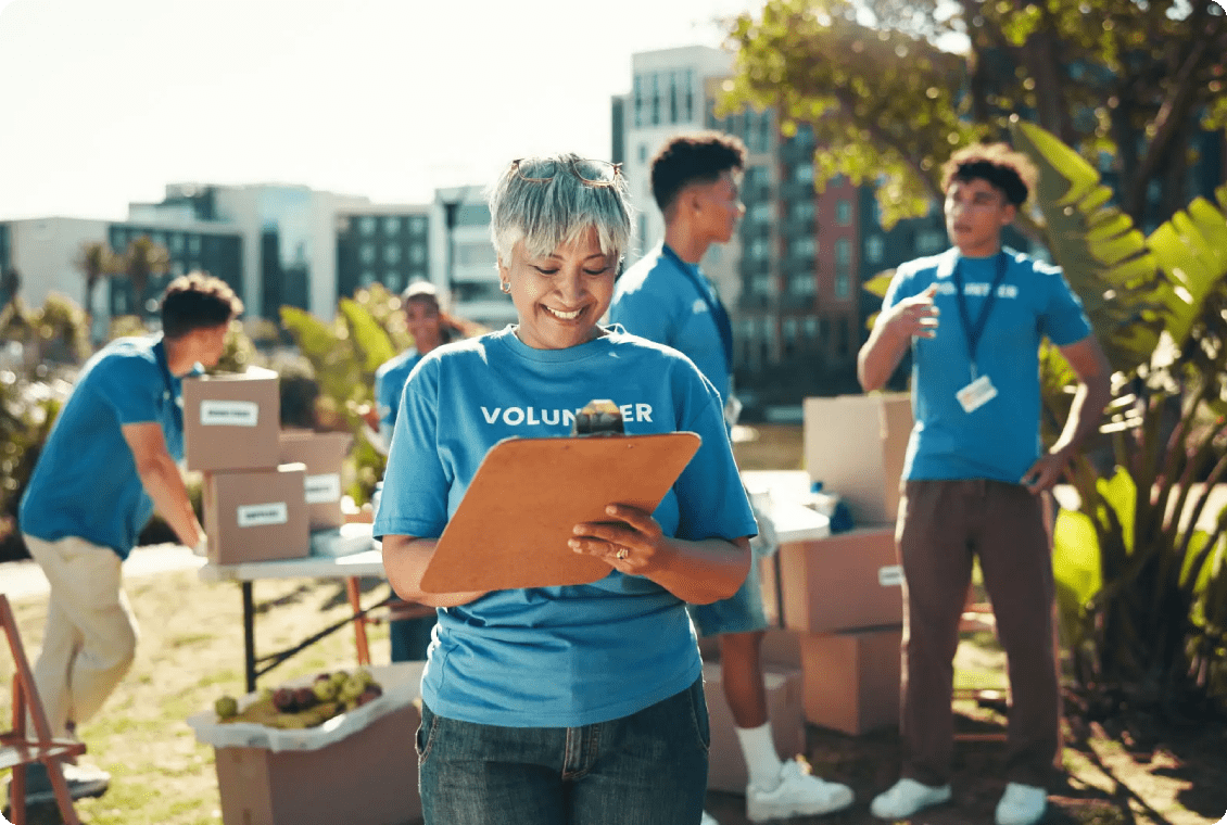Volunteer organizing supplies at a community event.